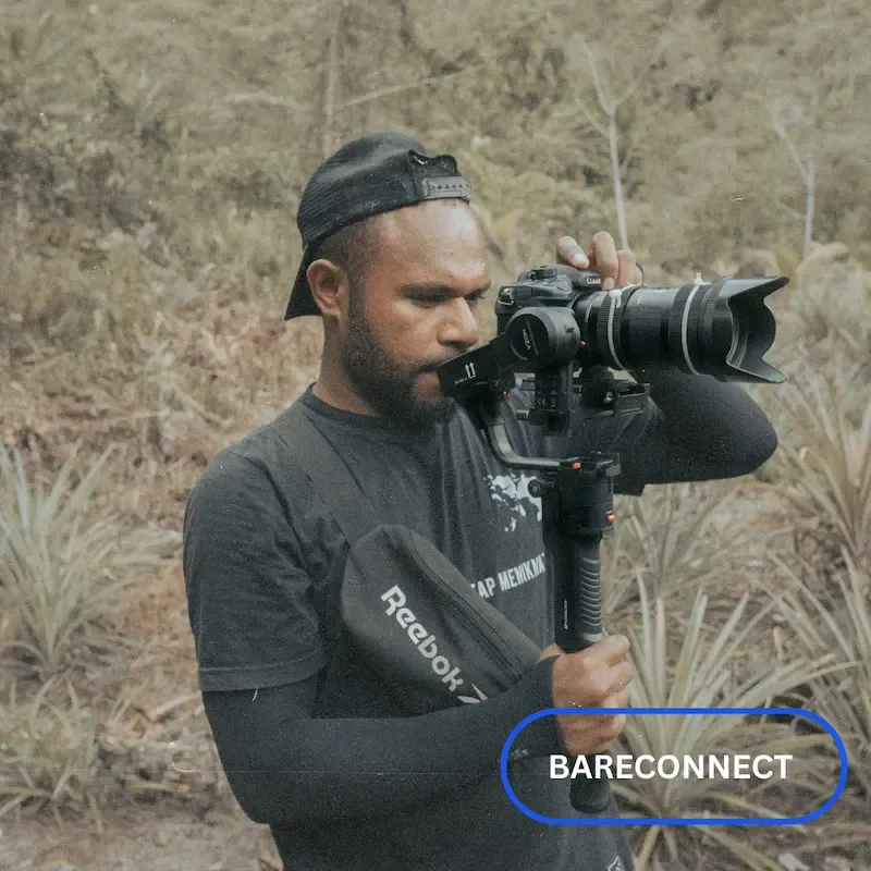 Influencer Nigeria Social media influencer creating content with camera setup for online growth.